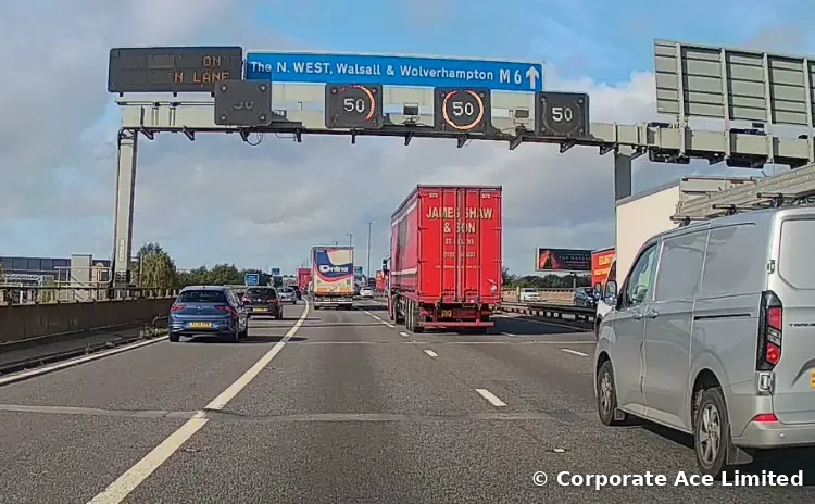 M6 overhead signs for The North West, Walsall and Wolverhampton with 50 mph speed limits shown over every lane